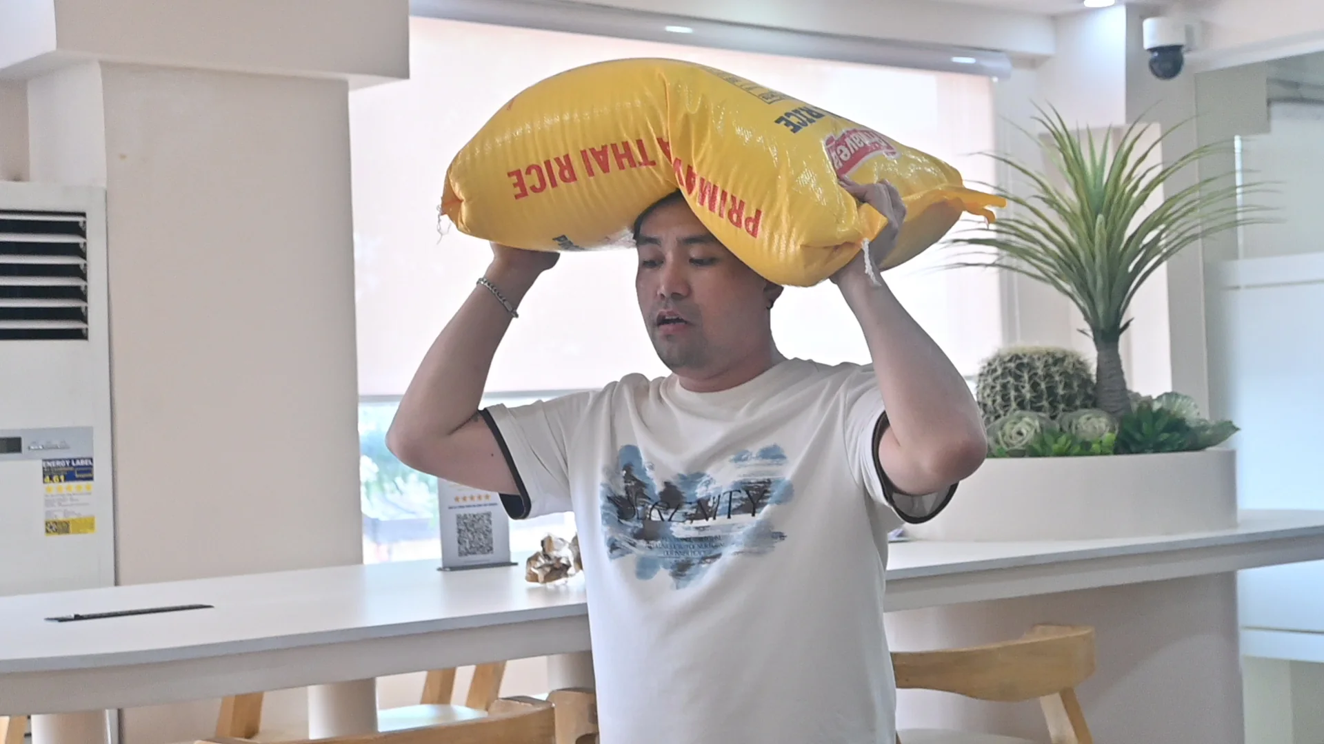 LFI volunteer carrying supplies for community distribution